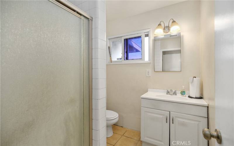 Primary ensuite bathroom with walk - in shower