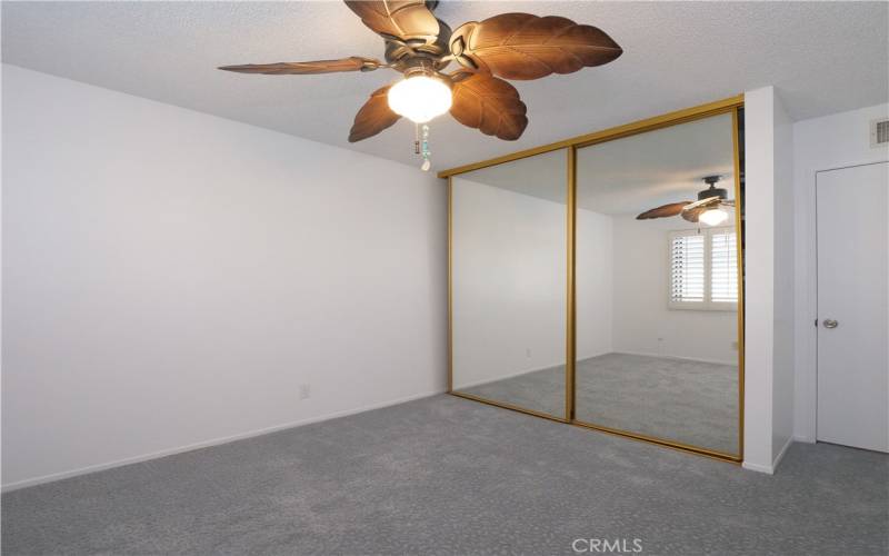 3rd Bedroom With Fan, Mirrored Closest Doors and Custom Closet Storage