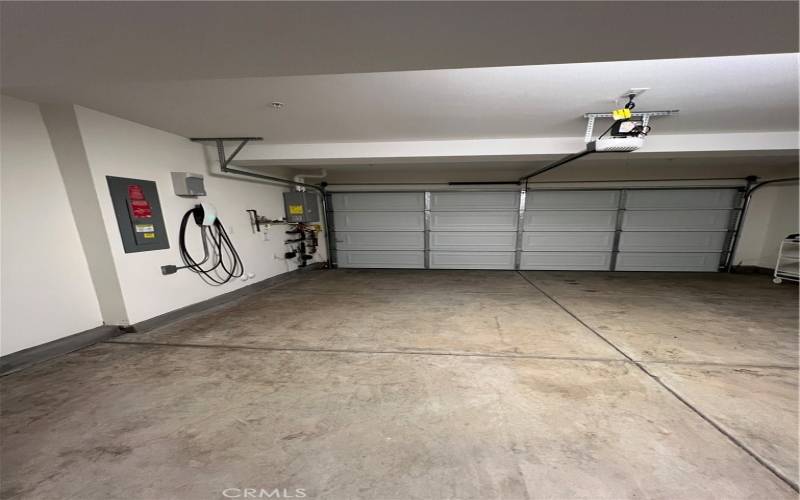 Inside the two car garage with the EV charger.