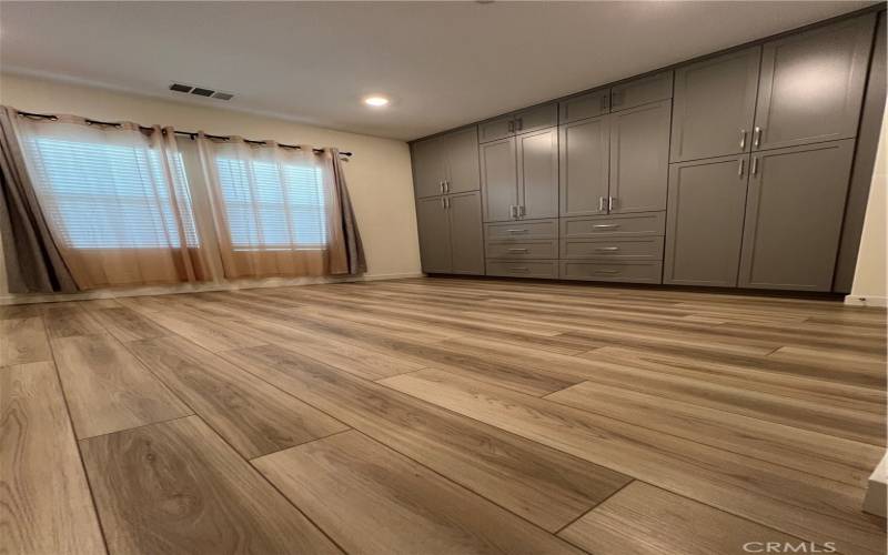 Primary bedroom with plenty of built in cabinet and storage.