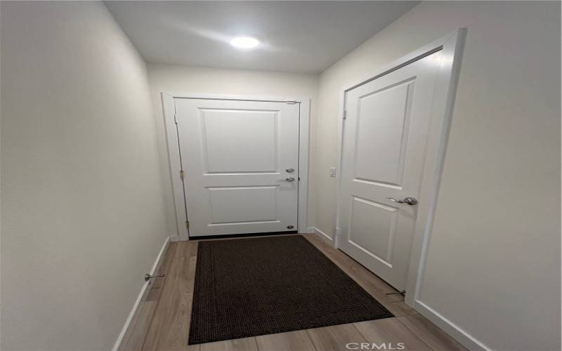 First floor hallway leading to the garage.