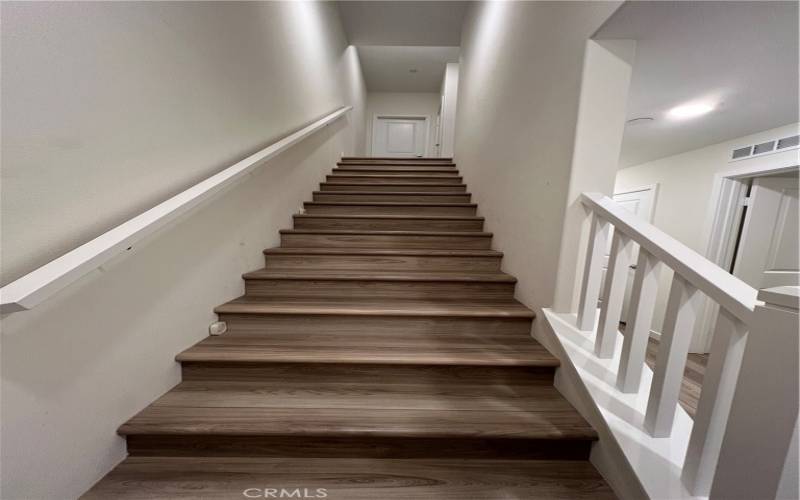 Stairs to the main living area in the second floor.