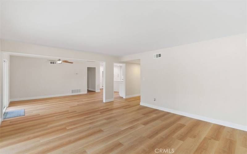 Hallway door leads to two large bedrooms and a remodeled full bathroom