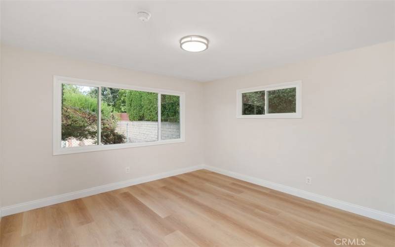 Large bedroom features two new double pane windows