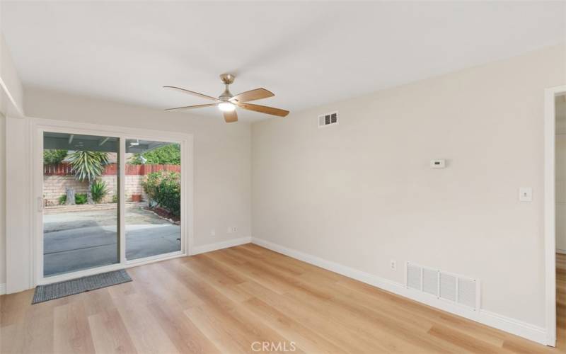 Dining area with slider that leads to back yard patio