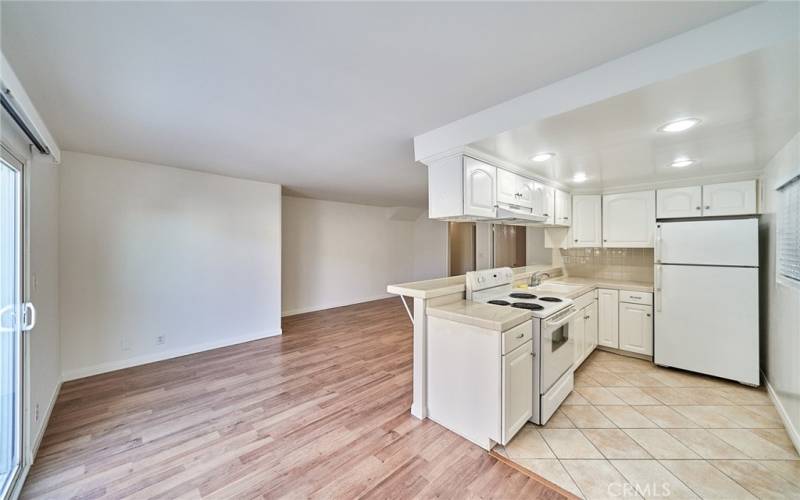 dining area attached to kitchen and leads out the sliding door.