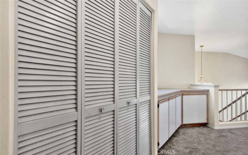 Upstairs laundry closet with washer and dryer inclouded