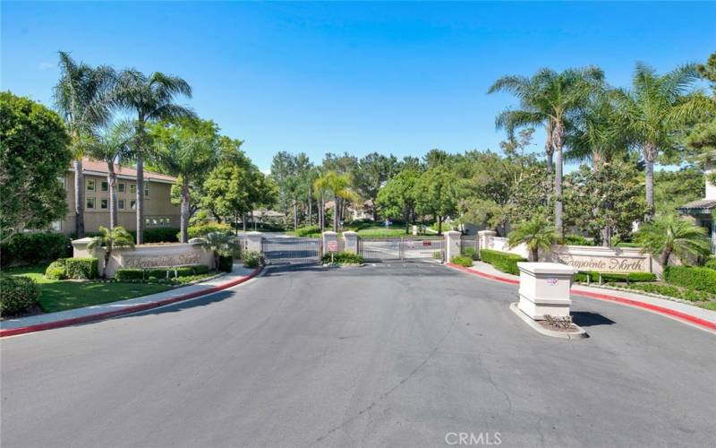 One of two gated entrances to community