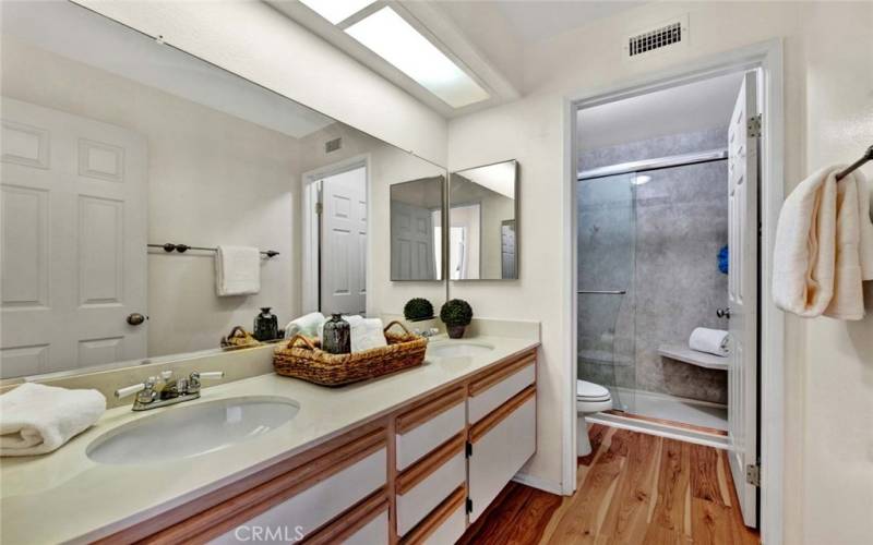 Guest bathroom with privacy door to toilet and shower