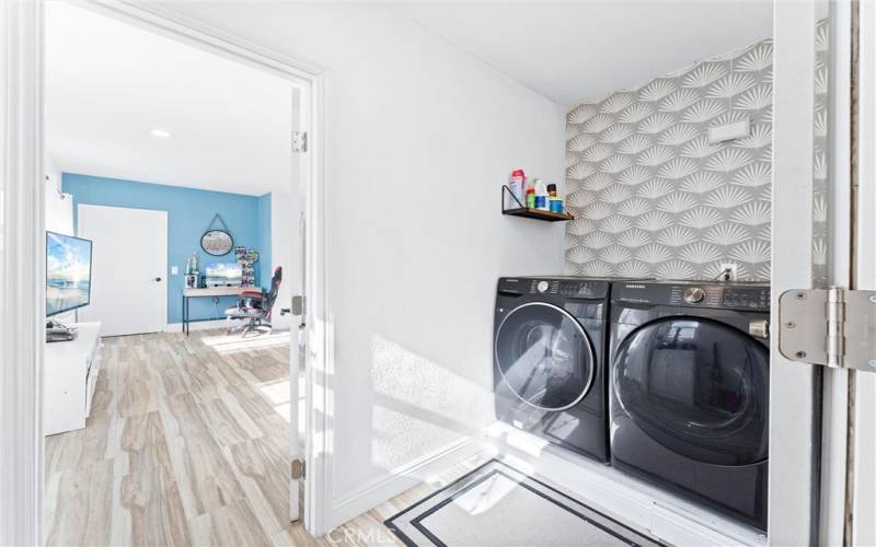 Inside laundry room off of 2nd primary bedroom and kitchen area