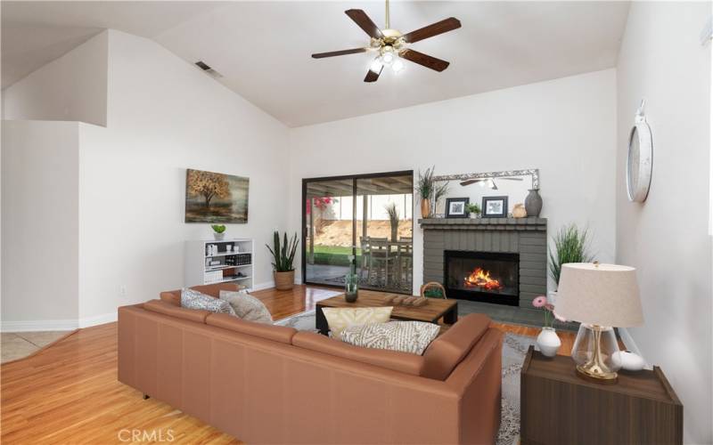 Living room with fireplace and sliding doors to large patio