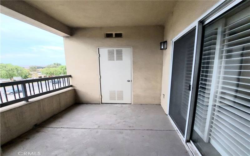 Balcony/patio, service door, with water heater inside.
