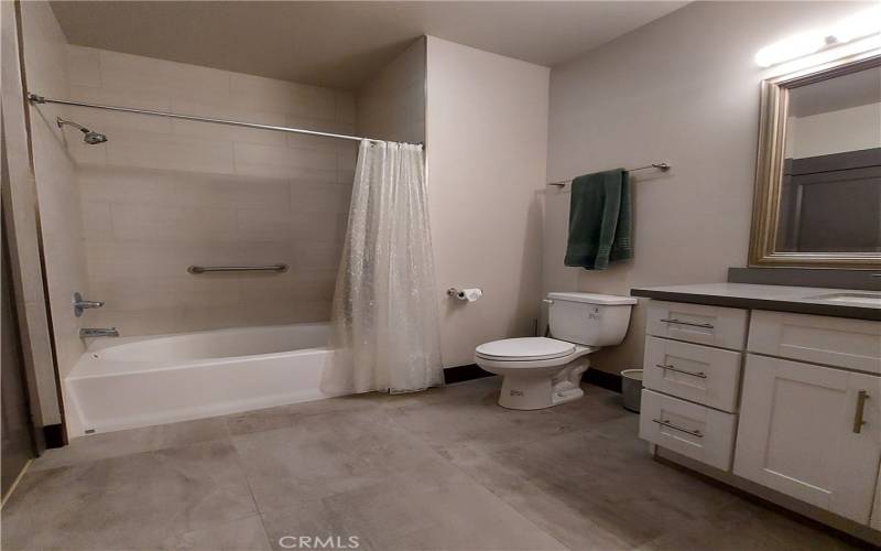 Spacious bathroom with stone countertops!