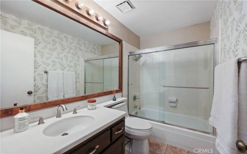 Bathroom with framed Mirror tub/shower