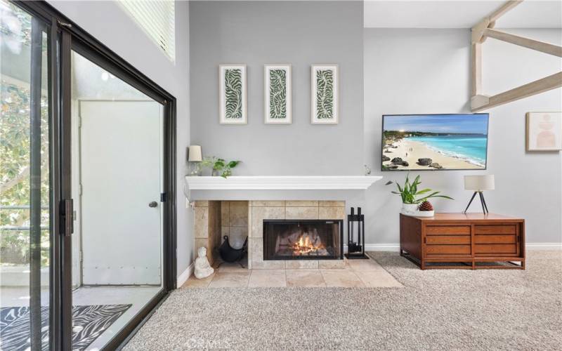 Living Room next to balcony and cozy fireplace