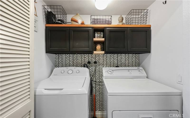 Laundry area behind 2nd closet doors across from Bathroom