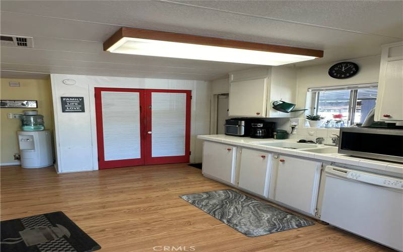 Kitchen-Showing pantry and door to carport.