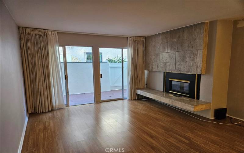 Living room with double slider doors to private patio