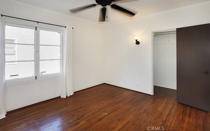 Bedroom #1 is away from the other two bedrooms and has a surprisingly large closet. It is located to the left of the living room. it would make a great office space if not a bedroom.