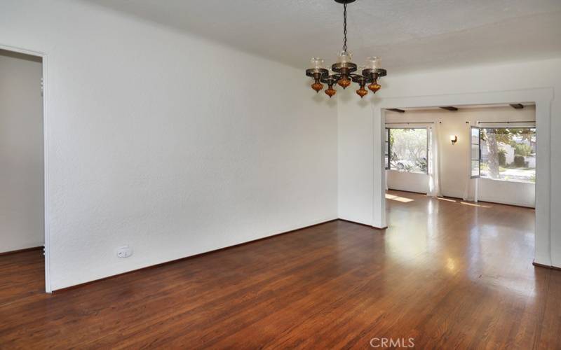 To the right of the dining room is a hallway with two of the three bedrooms and the full bathroom.