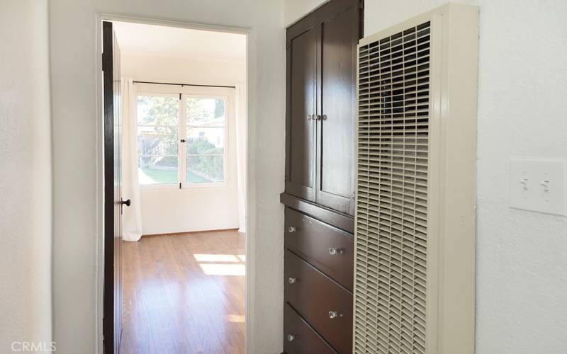 A wall heater in the hall warms those two bedrooms and a spacious built in linen closet is a necessity.