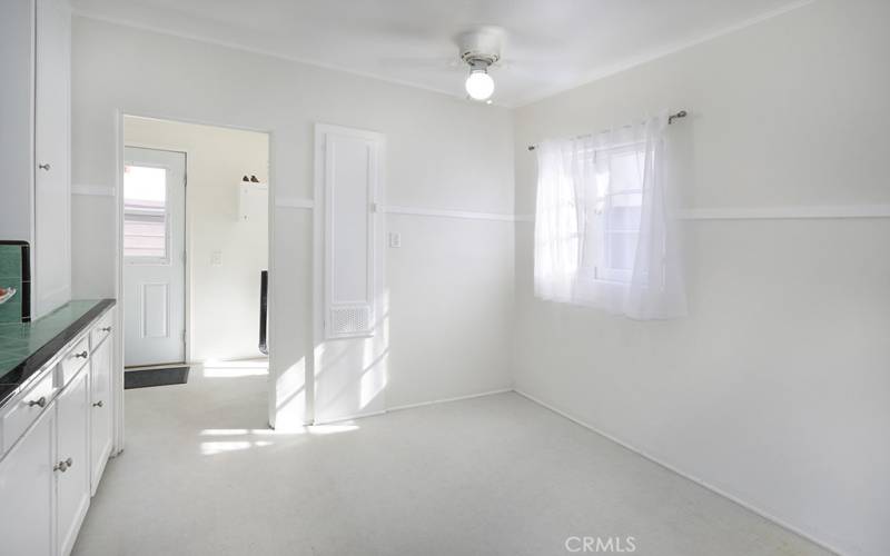 Imagine what you could do with this kitchen space. Maybe, a built in banquet with seating, storage and a table or floor to ceiling cabinetry or a kitchen island.