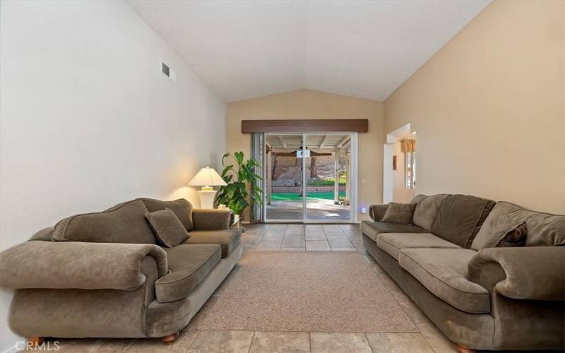 Living Room with Sliding Door to Backyard Patio