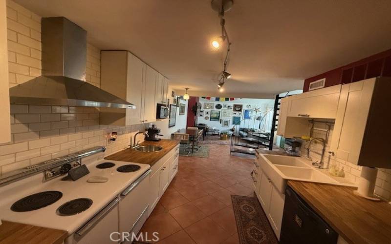 Kitchen with 2 separate sinks. Makes it easier to work on both sides. Nice farm sink and lots of storage