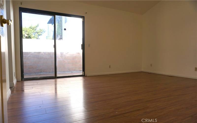 the primary bedroom has a slide door to the side yard