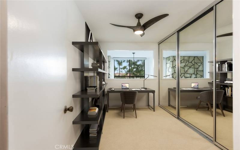 Virtually staged loft/office opens to dining room