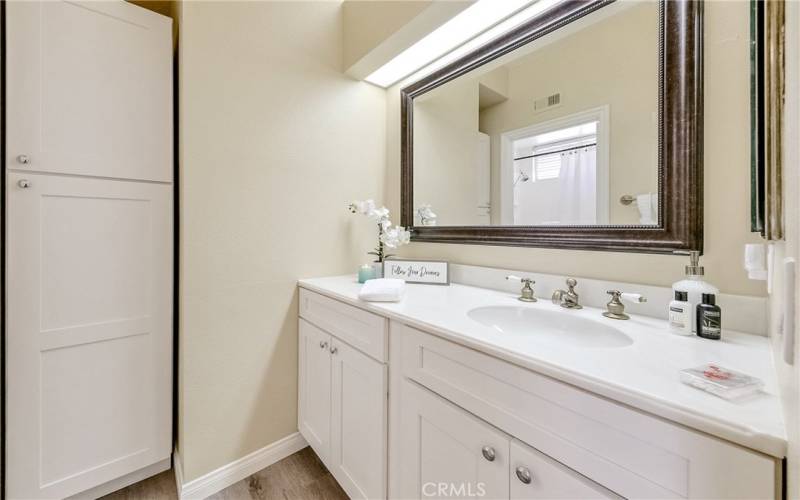 Primary Bedroom En Suite Vanity Area and Linen Closet