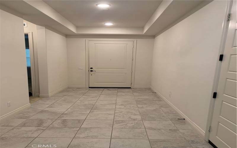 Formal entry with tile flooring