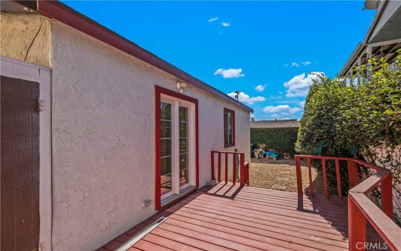 Back unit side patio with wood decking