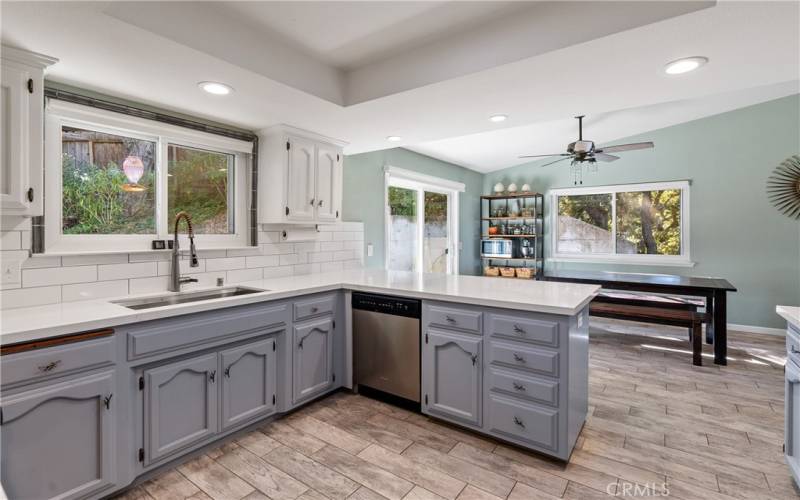 Recessed lighting, window above the sink and a solar tube illuminates the kitchen.