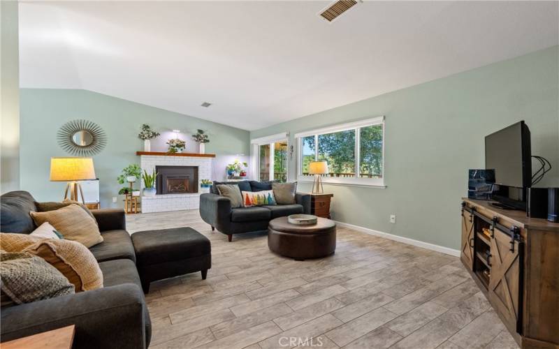 Entering the home you will appreciate the wood grain tile that flows throughout the living room, dining area and kitchen.