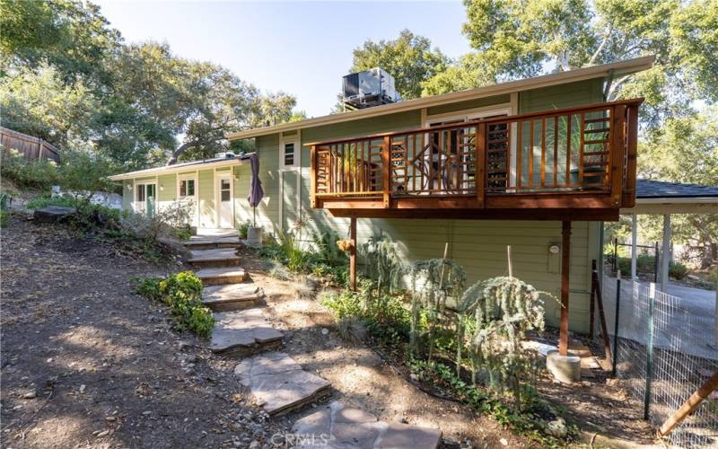 Flagstone steps lead you up to the back of the home.