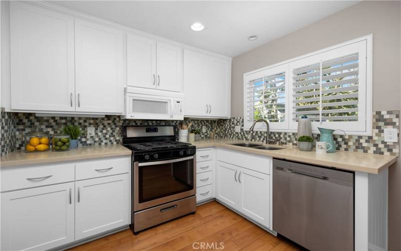 Sparkling white cabinets make this kitchen look brand new.