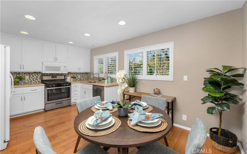 View of both the kitchen and the dining area. A desk would work in here too.