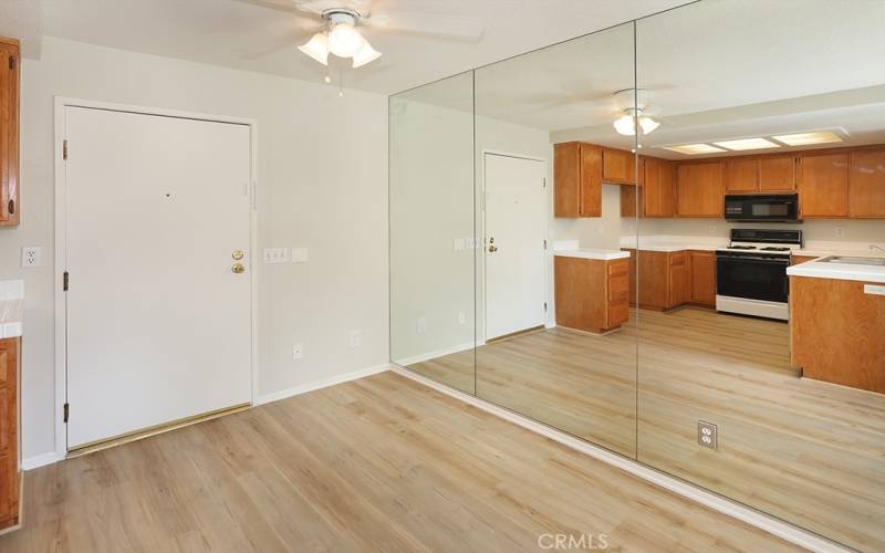 Dining room area has light reflective mirrors