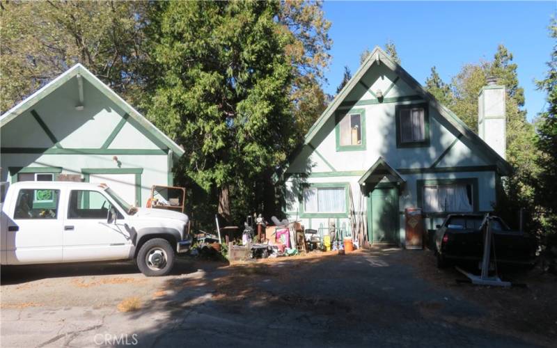 Front of home and motorcycle/workshop