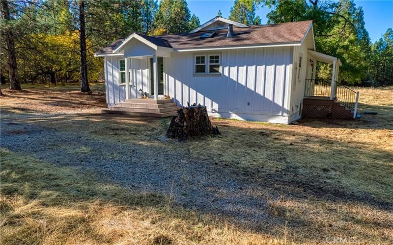 covered side by laundry room and bathroom enterance