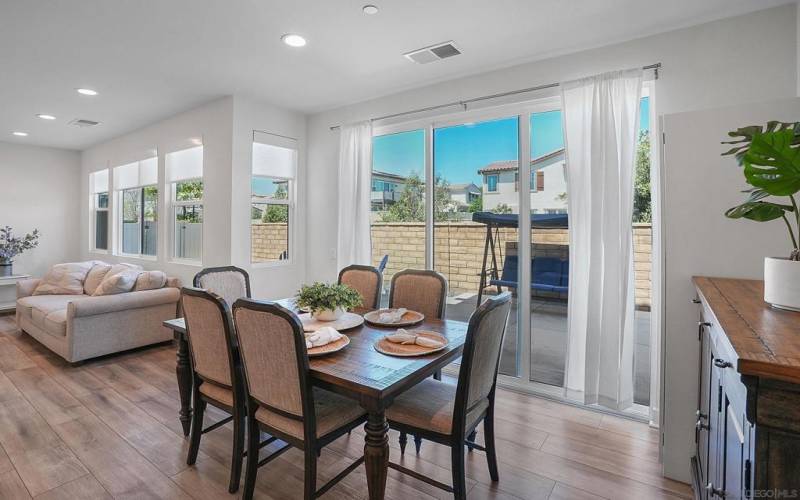 Gorgeous Flooring, Custom Blinds and Double Doors Leading to Spacious Yard on a Private Corner Lot!