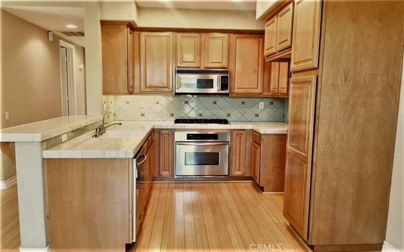 Kitchen with microwave, gas range and dishwasher