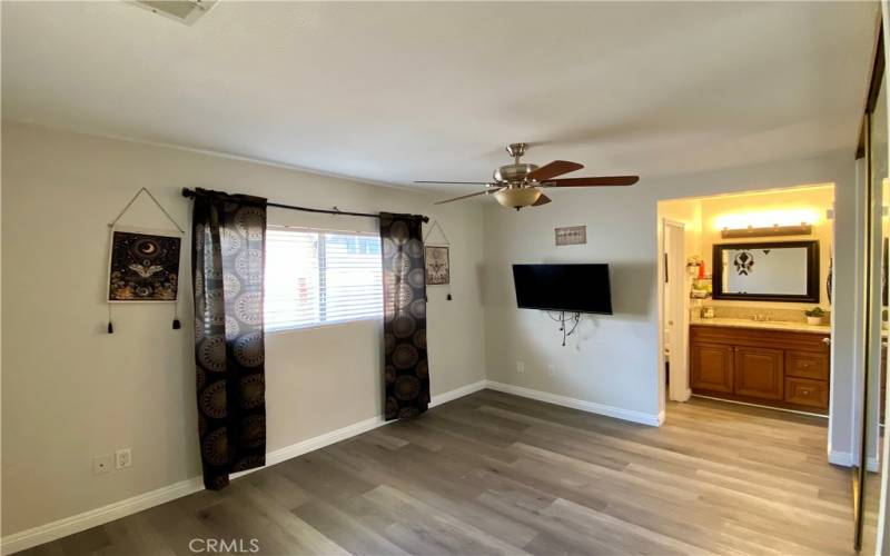 Primary bedroom , vanity area, private bathroom.