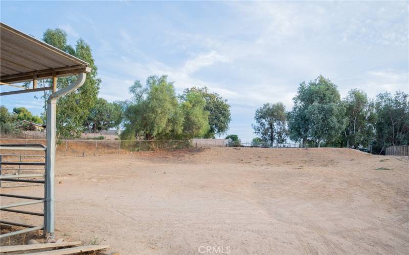 VIEW OF ALL THE SPACE AVAILABLE BEYOND THE HORSE CORRALS...ALL THE WAY BACK TO THE TREES. ROOM FOR ARENA, BARN MORE STALKLS OR EVEN AN ADU.