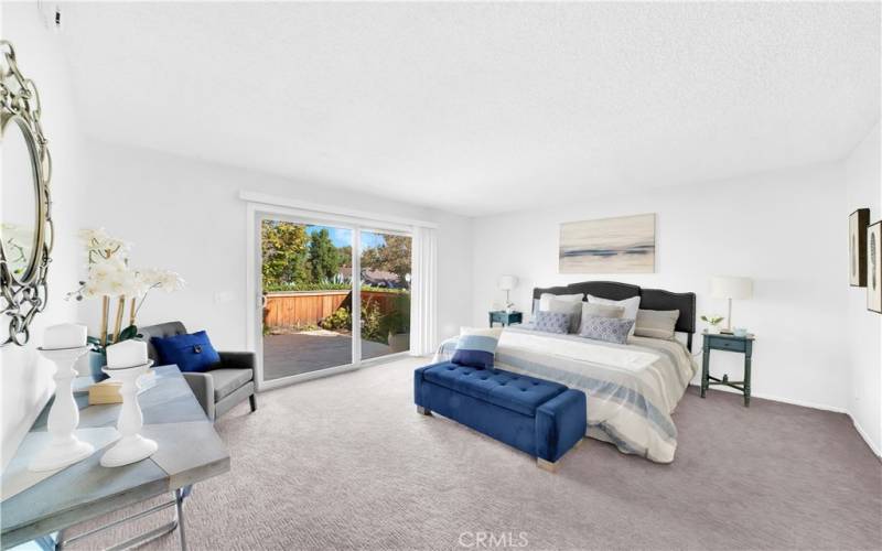 Primary Bedroom with sliding glass door to your private patio.