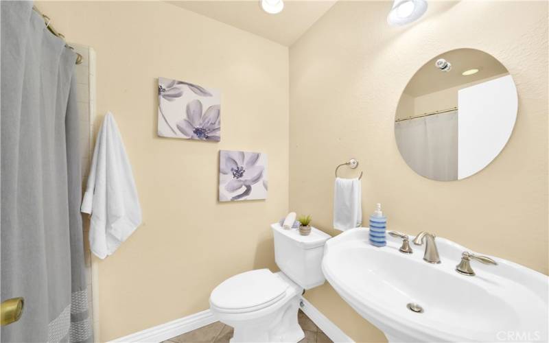 First floor guest bathroom with walk-in shower.