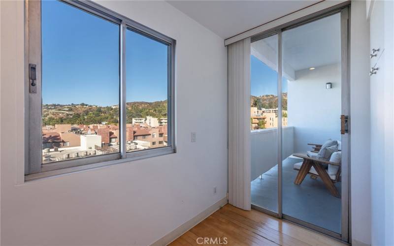 Kitchen leads to the balcony.