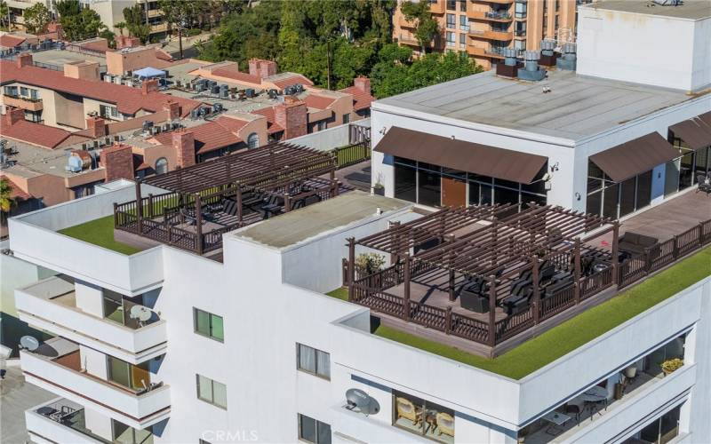 Rooftop gym, dog run, and two lounge areas.