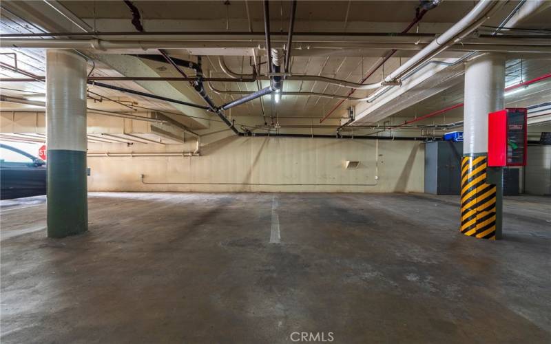 Large subterranean garage for residents and guests.